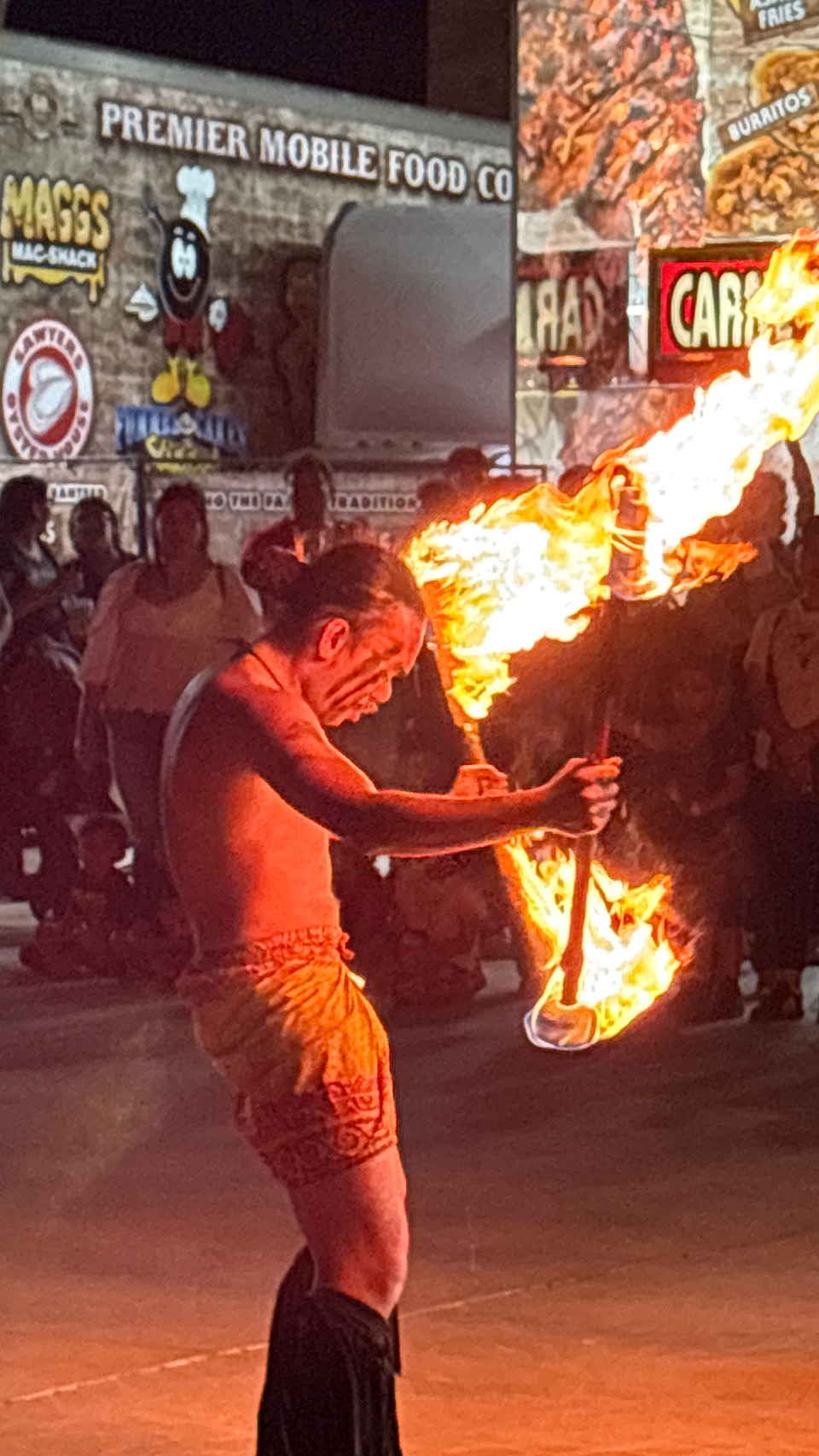 Fire dancer with flaming staff