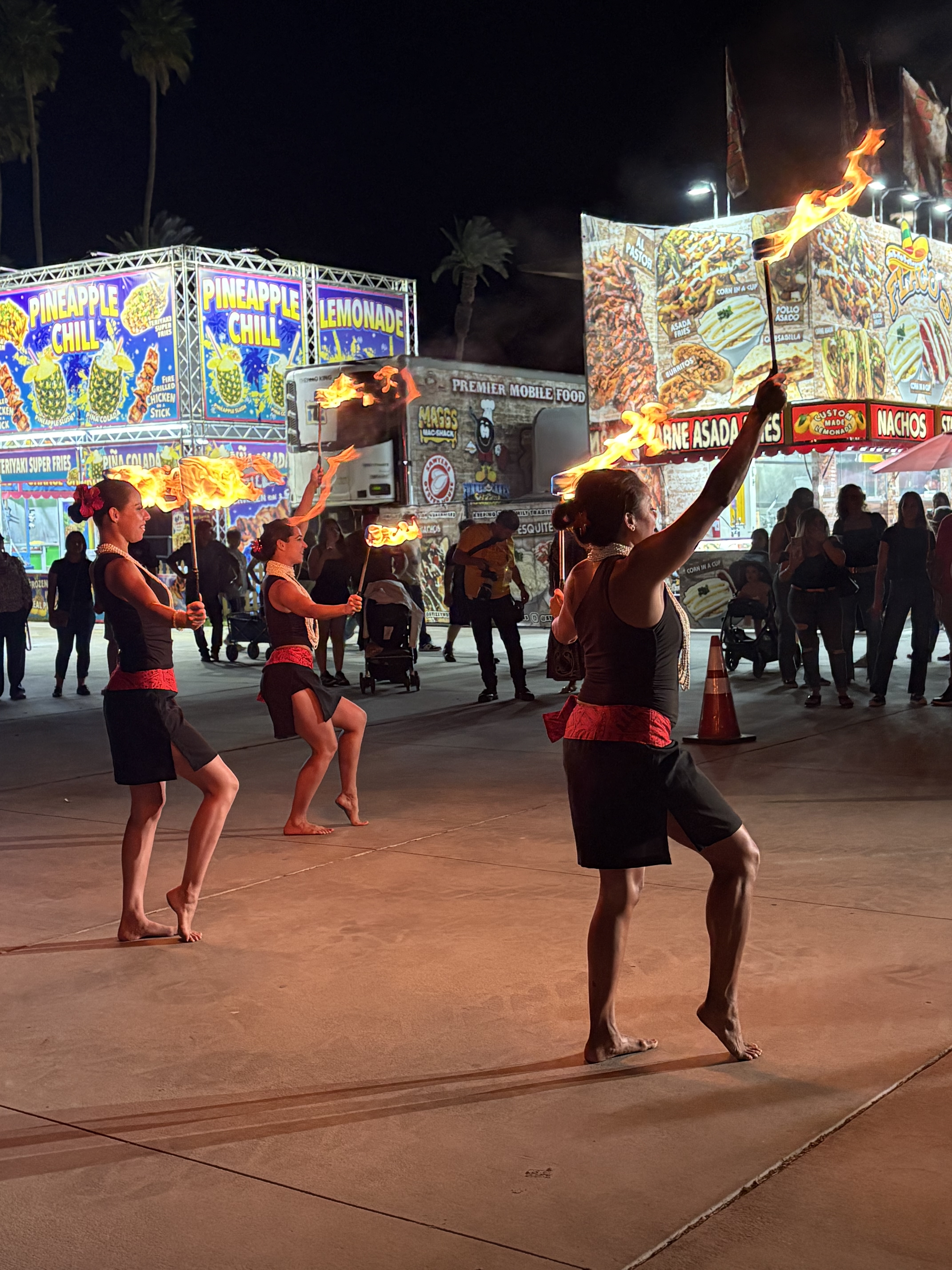 Fire dancers performing at night event